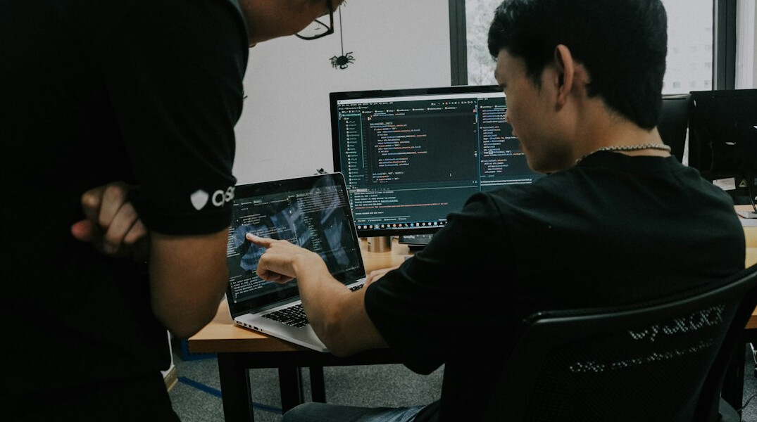 team of programmers coding